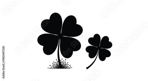Two black four leaf clovers with stems and leaves a silhouette