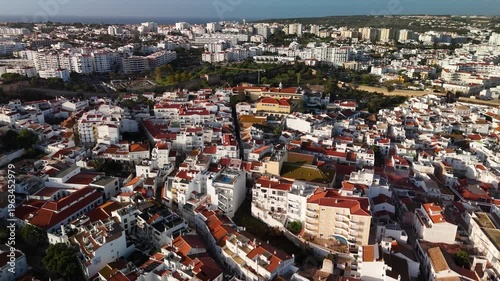 Wide High Altitude Aerial of Lagos Urban Landscape and Sunny Winter Sky in Algarve Portugal