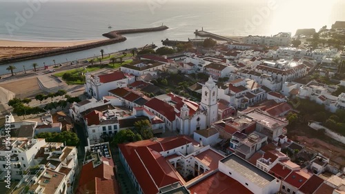 Bird's Eye Aerial View of Historic Old Town Churches and Architecture in Lagos Algarve Portugal