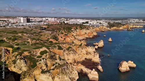Aerial View of Lagos Cityscape from Ponta da Piedade Cliffs Algarve Portugal Coastline Drone