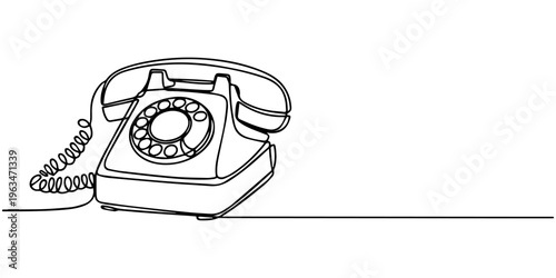 Vintage rotary telephone on a table against a clean white background representing classic communication technology 