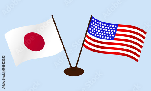 Developing flags of the USA (United States) and Japan, standing on the same stand
