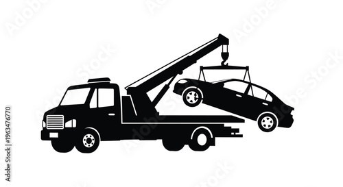 A tow truck transports a damaged vehicle on the roadway silhouette