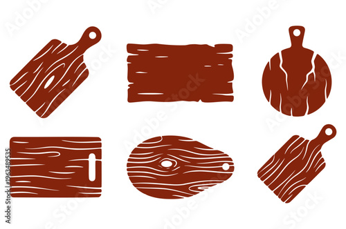 Collection of various wooden cutting boards with rustic wood grain patterns