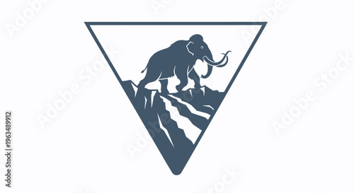 Mammoth walking on mountain peak.