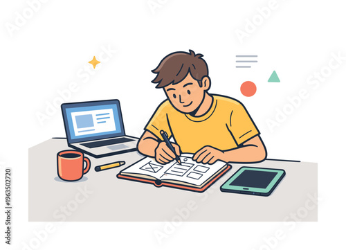 Young designer sketching website wireframes on a notebook with laptop and tablet