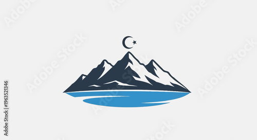 Majestic mountain range with a crescent moon and star above reflecting in blue water
