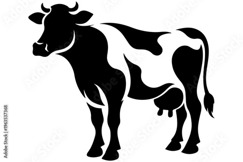 Mother cow with calf standing in a field silhouette style