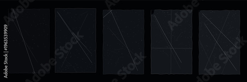 Five black rectangular objects with subtle texture and faint lines