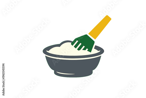 Mixing batter in a bowl with a green and yellow utensil in a simple kitchen setting