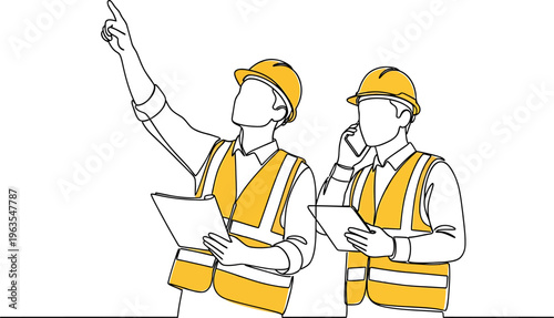 Two construction engineers in hard hats and vests pointing and communicating on site.