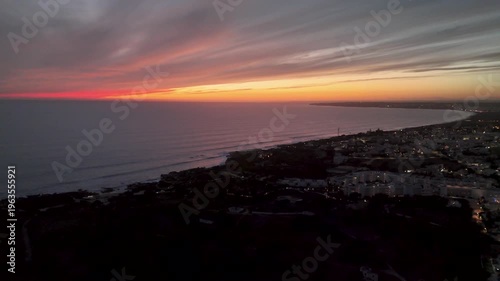 Aerial Sunset Horizon Over Evaristo Coastal Town and Atlantic Ocean in Albufeira Algarve Portugal