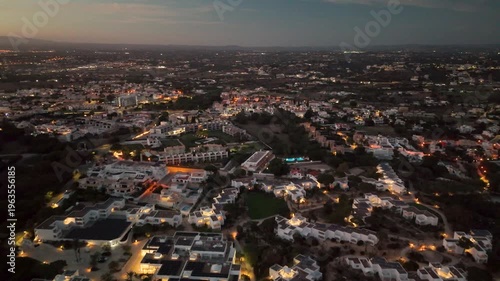 Dusk Aerial Perspective of Evaristo Village and Twinkling Lights in Albufeira Algarve Portugal