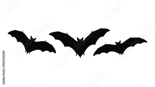 Three black bat silhouettes flying together