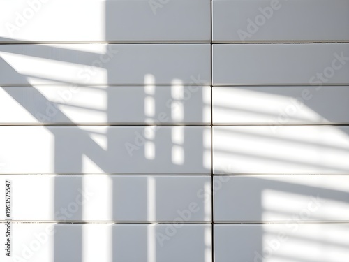 A modern wall with shadows cast by a window