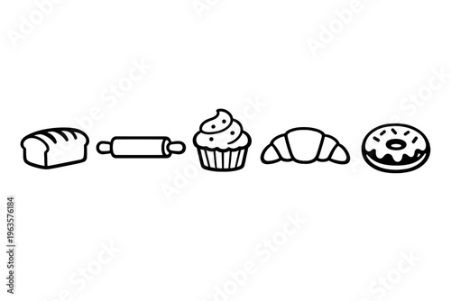 Baking items on a table with bread, rolling pin, cupcake, croissant, and donut displayed in a simple layout