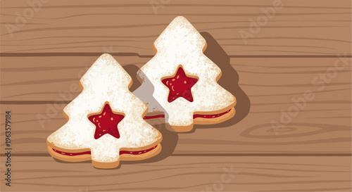 Two festive tree-shaped cookies with red jam centers on wood
