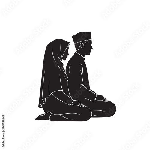 A Muslim couple kneels together in silent prayer or contemplation, showing devotion.