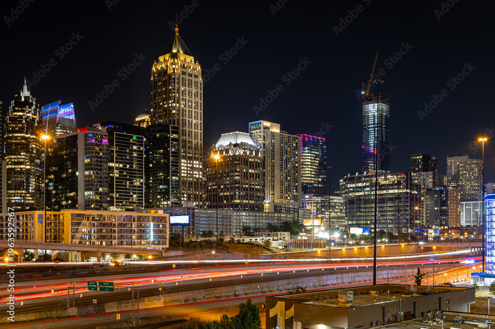 Fototapeta premium Atlanta Night Skyline with Light Trails on Highway and Illuminated Midtown Towers