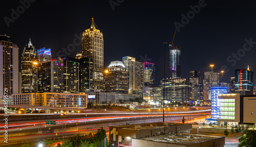 Atlanta Night Skyline with Light Trails on Highway and Illuminated Midtown Towers