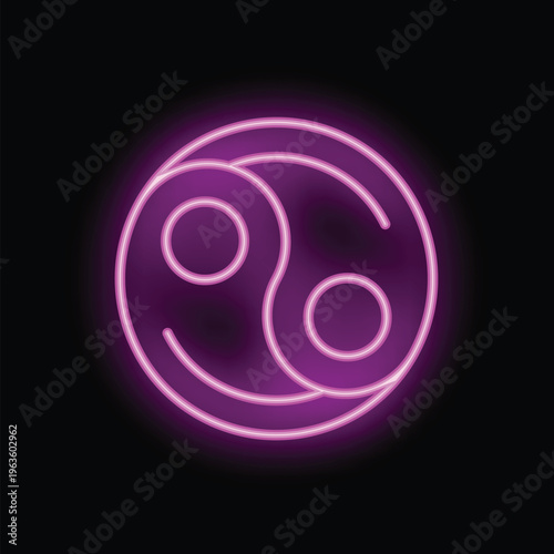 Pink neon sign is glowing in the dark, showing the yin yang symbol of balance