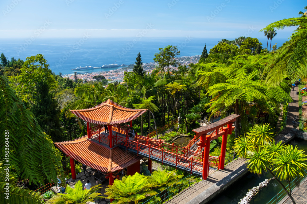 Fototapeta premium Monte Palace tropical garden with red pagoda, lakes and traditional buildings above the city of Funchal, popular tourist destination in Madeira island, Portugal