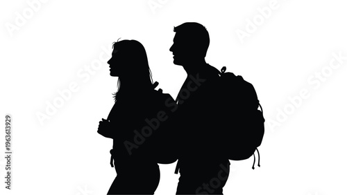 Couple with backpacks facing away a striking black silhouette
