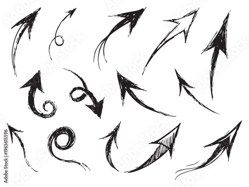 A collection of handdrawn black arrows on a pointing in various directions and styles