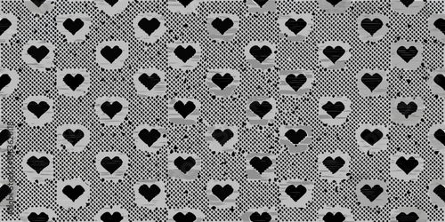 Black and white pattern featuring repeating heart shaped cutouts