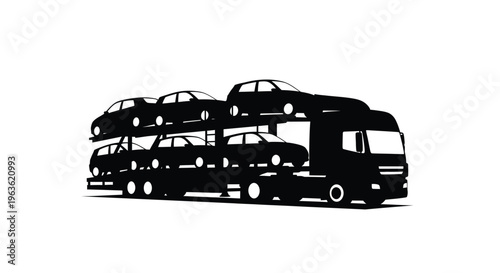 A car carrier truck transports vehicles in a stark silhouette