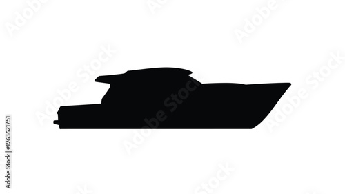 A sleek dark yacht is presented in a striking silhouette