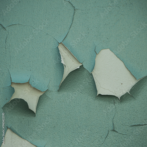Teal peeling paint texture on cracked wall