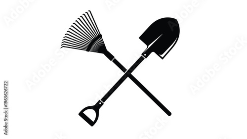 Crossed garden tools a rake and shovel in black silhouette