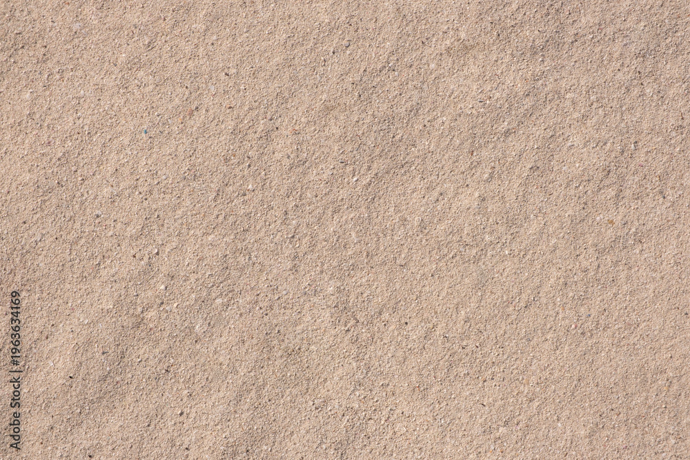 Fototapeta premium Close-up of beige carpet texture, soft fibers, natural fibers, uniform pattern. Ideal for backgrounds, design, or texture overlays in creative projects