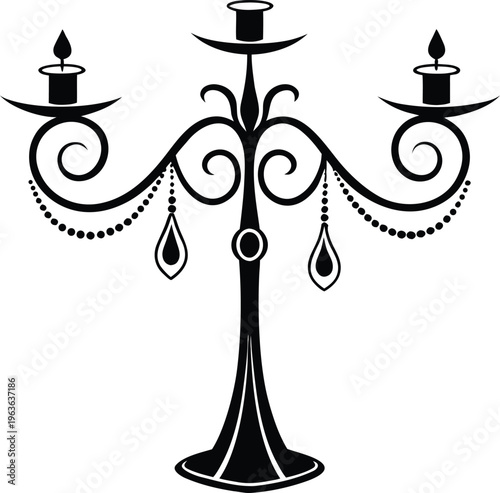Elegant black candelabra with three candles and ornate metalwork