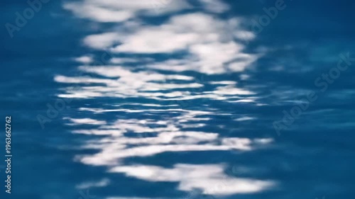 Wallpaper Mural Extreme macro deep sapphire blue water surface, subtle rhythmic undulations, shimmering ethereal highlights, ultra-smooth tracking zoom, minimalist shallow DOF, concept of effortless fluid data flow Torontodigital.ca