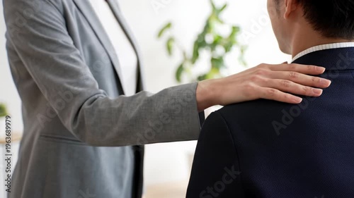 Wallpaper Mural Professional colleagues in muted business-casual attire showing empathy and support in a contemporary office with blurred bokeh, slow push-in video. Concept of team collaboration and trust Torontodigital.ca