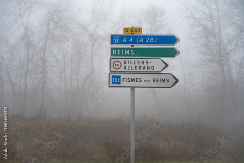 Road signes, driving directions on roundabout, street, highway, travel destination in Champagne, touristic route, France