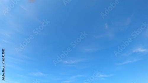 Wallpaper Mural Ultra-wide drone video of an immense, pristine light blue sky with delicate, wispy white cirrus clouds, bathed in clean natural daylight. concept of limitless possibilities Torontodigital.ca