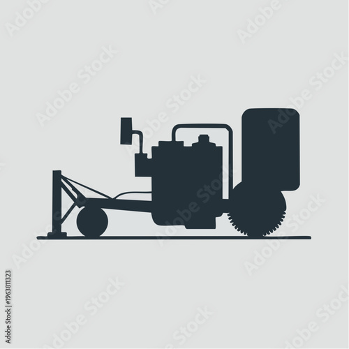 black silhouette of a lawn aerator machine