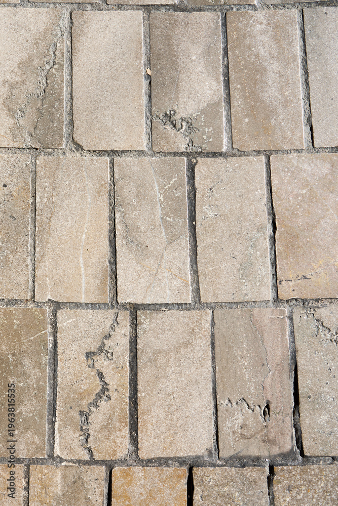 Fototapeta premium A medieval street paved with stone tiles.