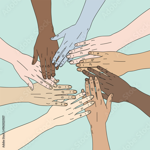 Diverse hands stacked together in unity.