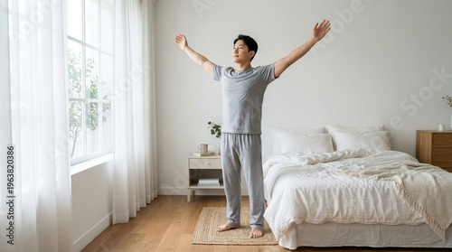 Man stretching in calm bedroom morning routine for better sleep