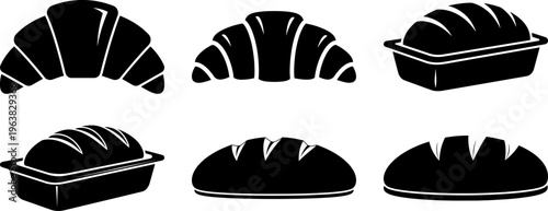 Collection of bread and croissant silhouettes in baking pans and on plate