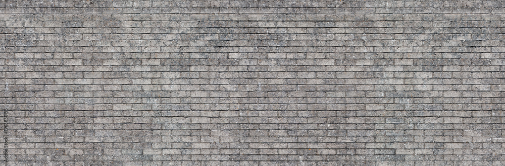 Concrete gray block wall seamless background texture – old grey brick pattern building.