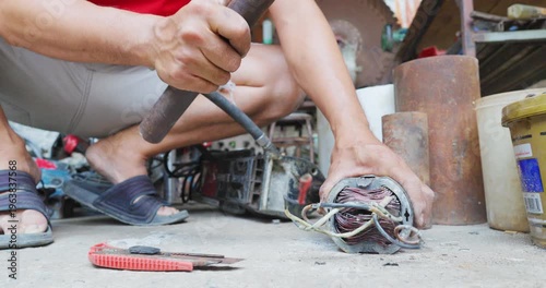 Business industry man hand fix electric motor tool in home business DIY