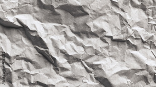 Close up of crumpled paper texture showing folds and shadows in grayscale