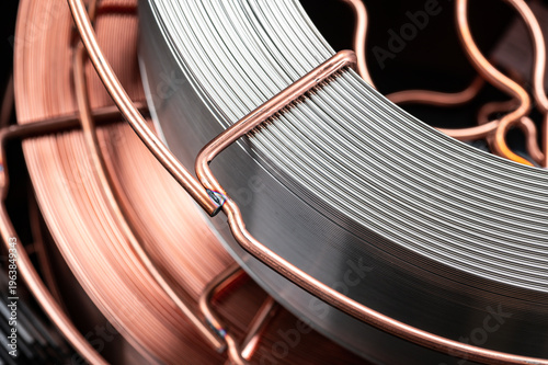 Tableau sur toile Copper and steel welding wire spools close up