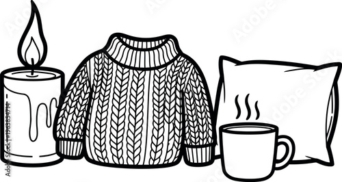 Cozy evening setup with candle sweater pillow and hot beverage
