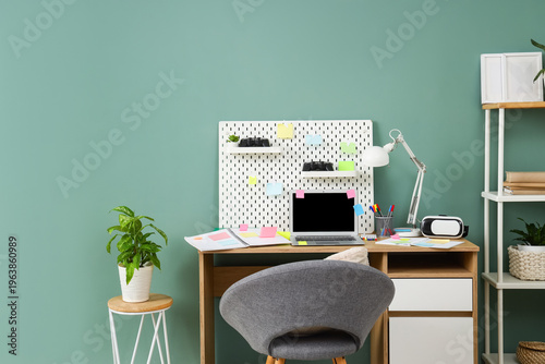 Workplace with blank laptop...